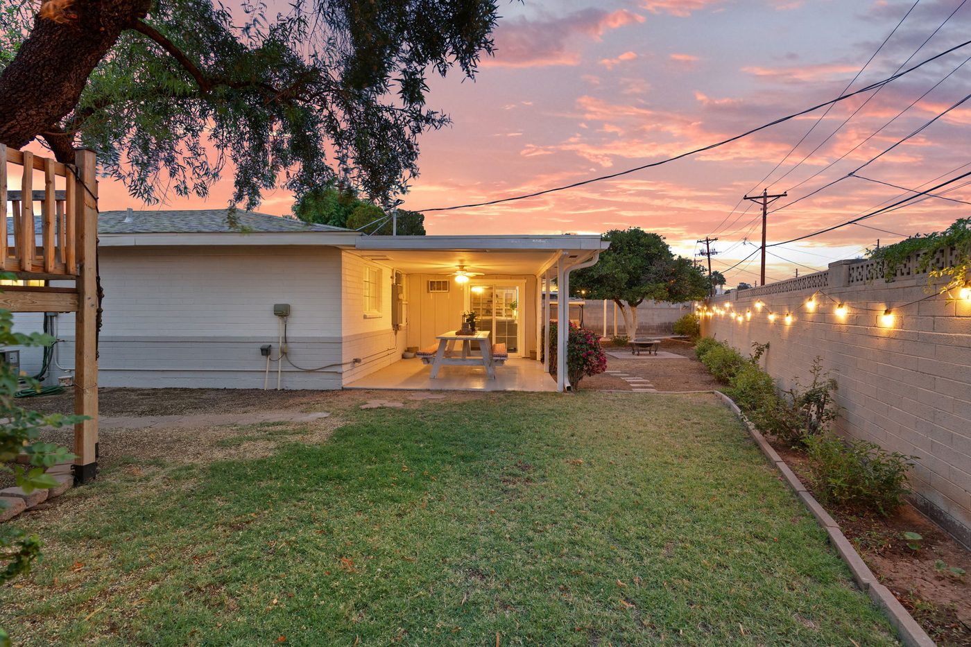 Back yard and covered patio at twilight at 3839 E Vernon Ave, Phoenix